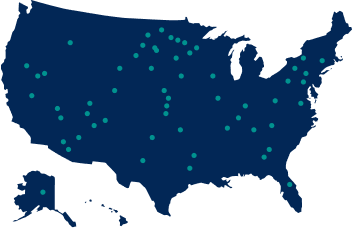 A navy map of the united states with teal dots.