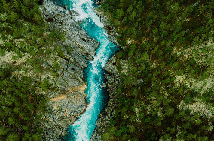 An overview shot of a river within mountains