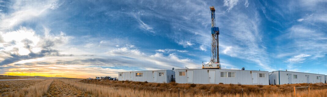 An open field with industrial trailers